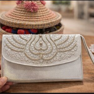 Elegant Silver Clutch with Embroidered Design